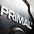 Close-up of a 'PRIMAL' logo on a metallic surface