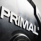 Close-up of a 'PRIMAL' logo on a metallic surface