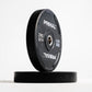 Two black Primal weight plates on a white background