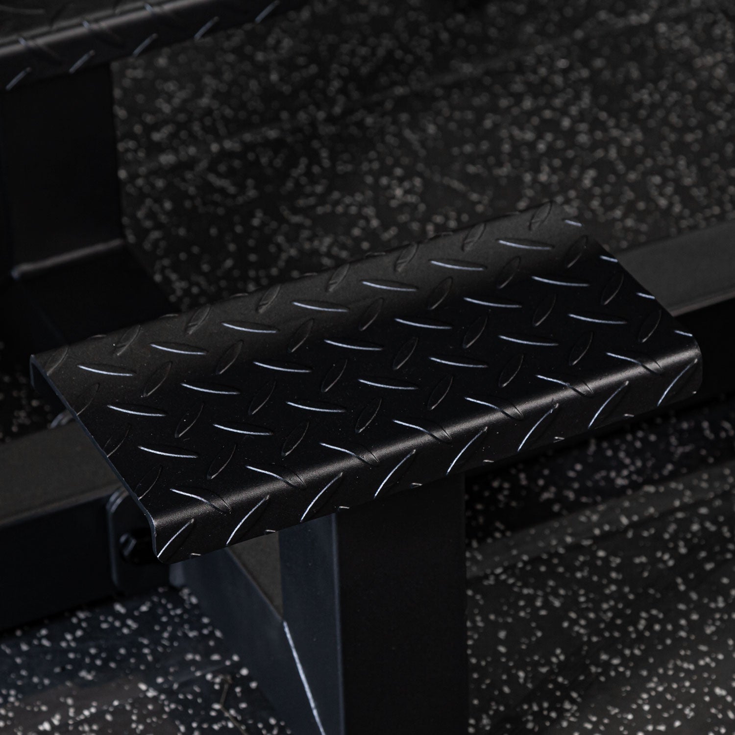 black prone row gym bench foot step