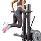 a woman performing dips on a belt squat gym machine
