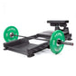 a black floor hip thrust  and glute ham developer bench with loaded barbell 
