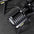 A top-down view of a 34kg adjustable dumbbell on a storage stand.