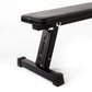 the primal strength laser cut logo on a gym weight bench