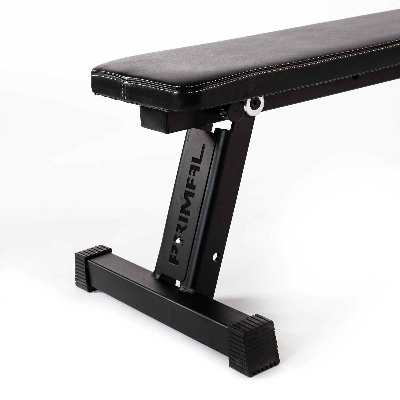 the primal strength laser cut logo on a gym weight bench