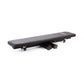 a black flat folding gym weight bench folded flat