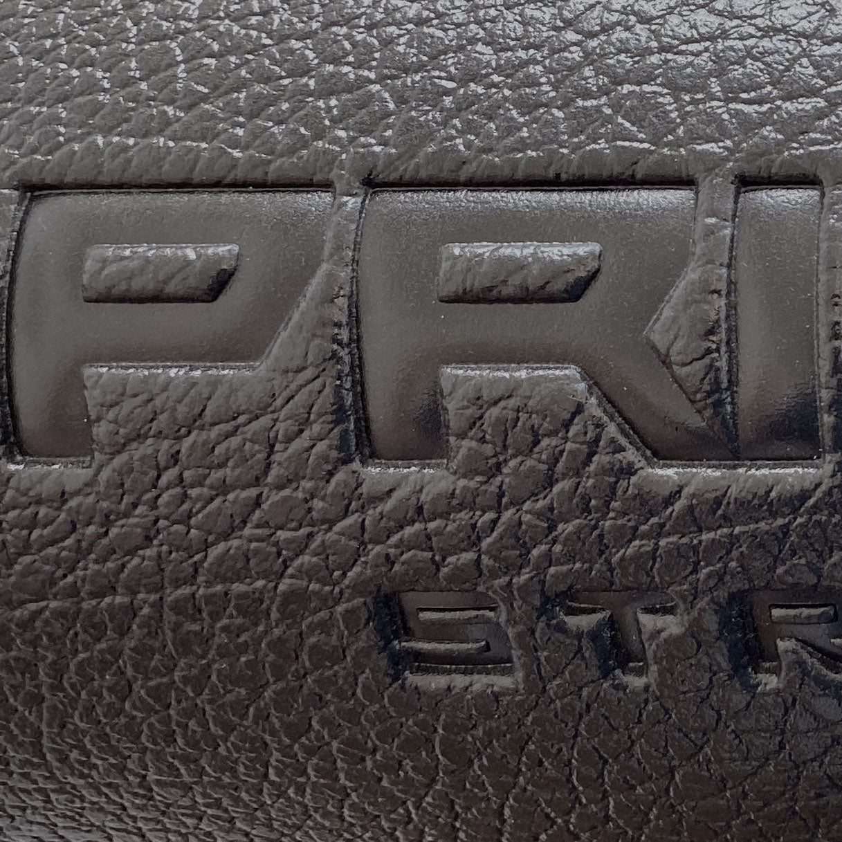 the embossed primal strength logo on a cardiovascular machine mat