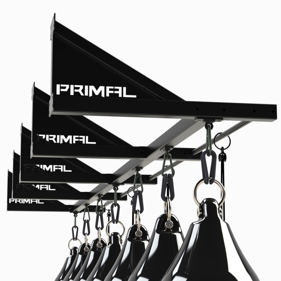 a row of boxing bag rigs