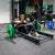 a woman performing hip thrusts with a hip thrust barbell and floor hip thrust bench