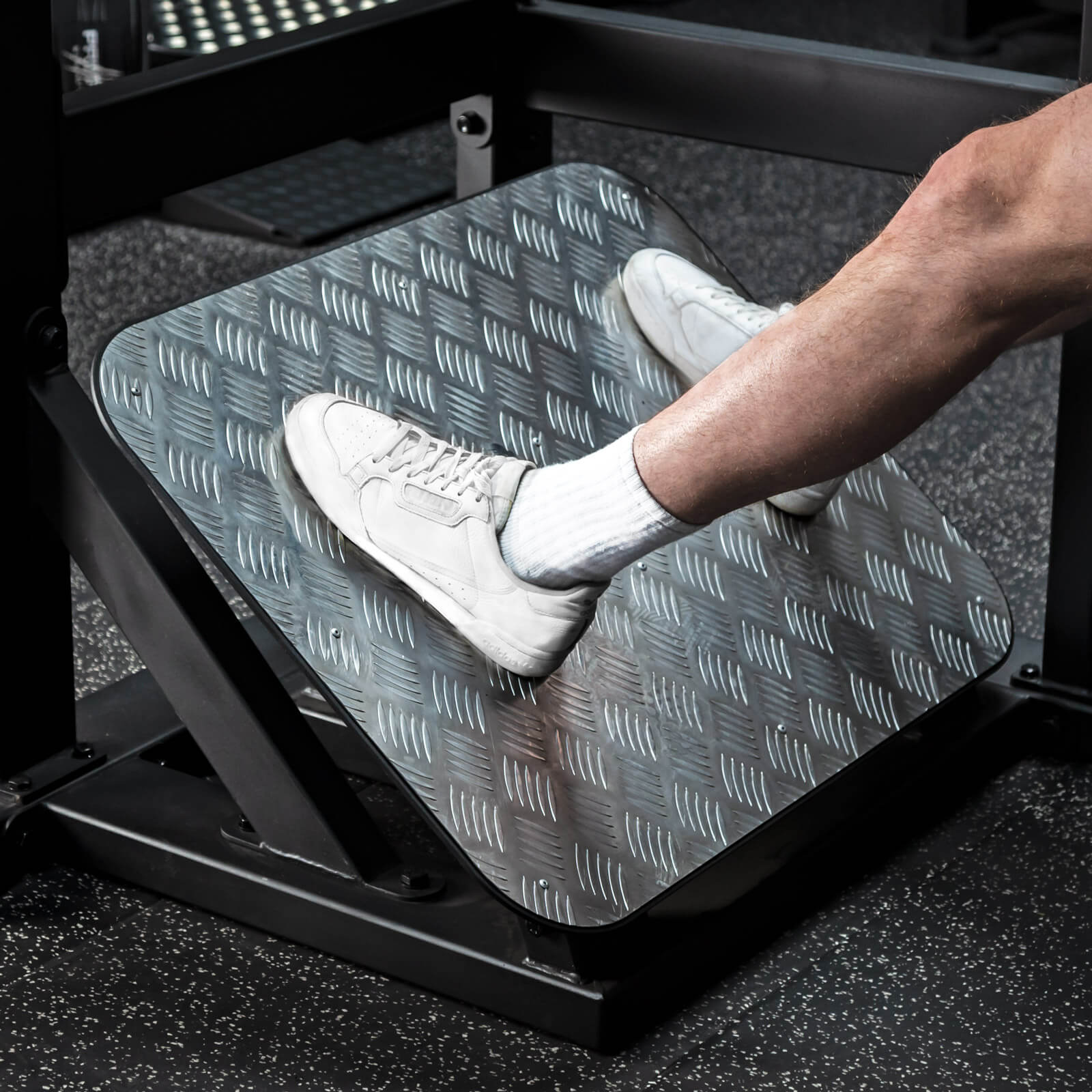 the footplate of a pendulum squat gym machine