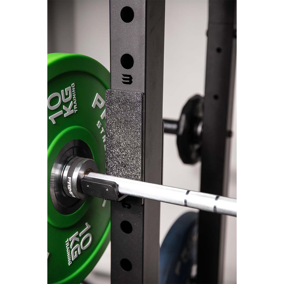 a rack barbell on a commercial half racks j hooks