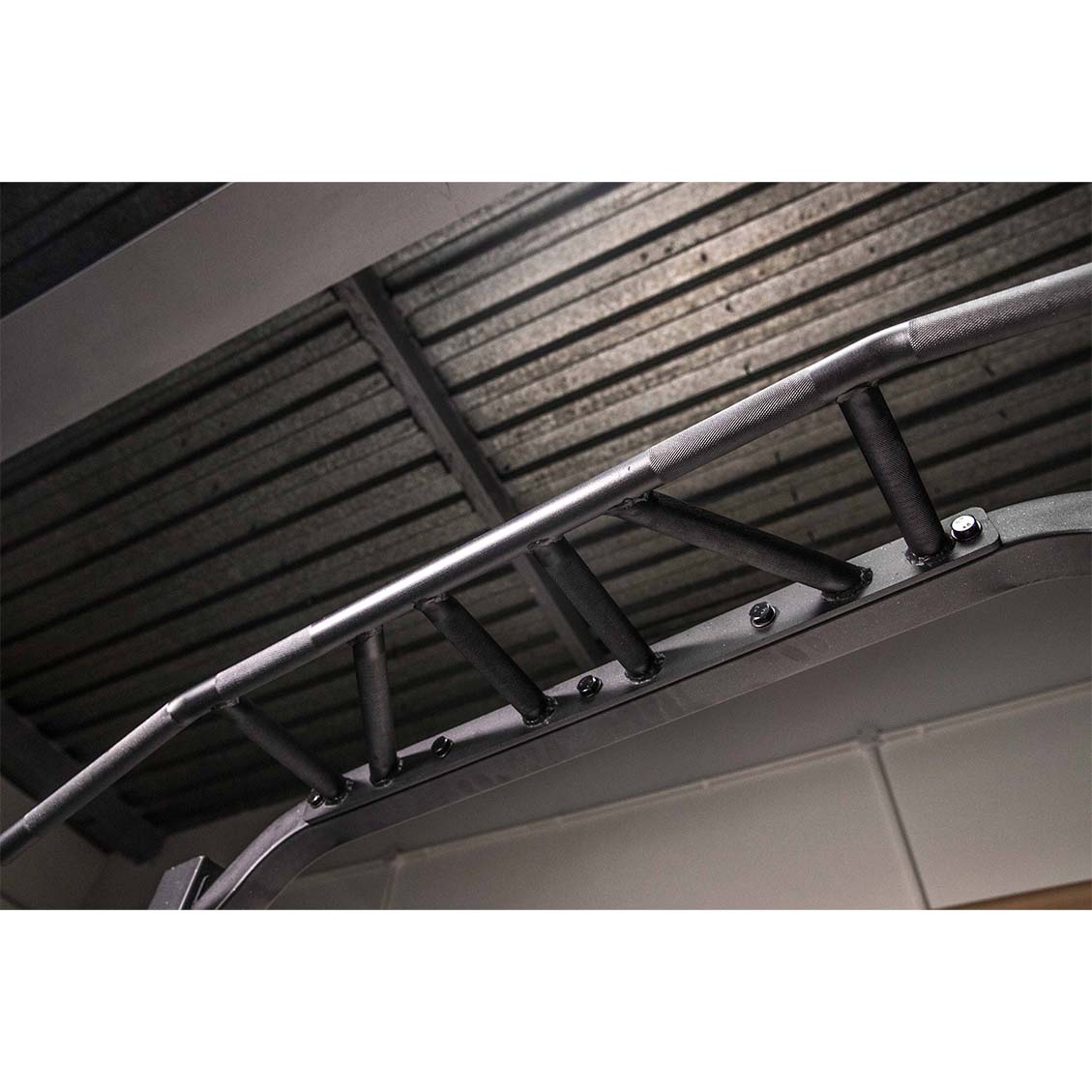 the multi grip pull up bar on a commercial half rack