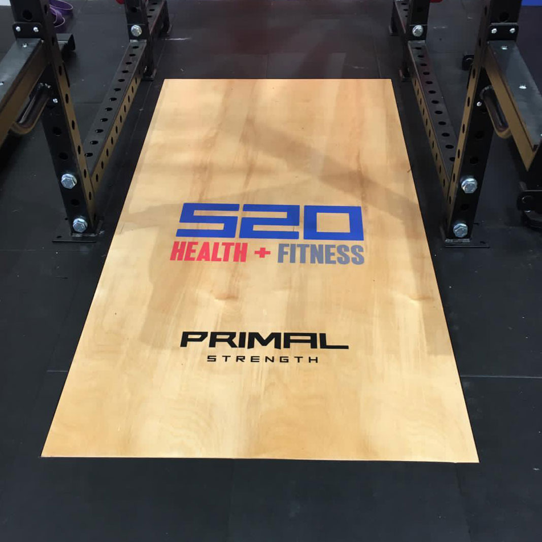 a custom olympic lifting platform with the s20 fitness and primal strength logo