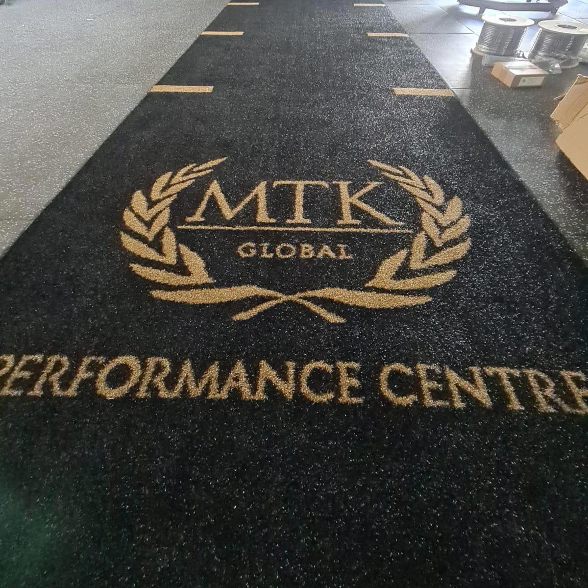 a custom mtk global black astro turf gym track