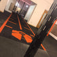 a custom black and red astro turf gym track