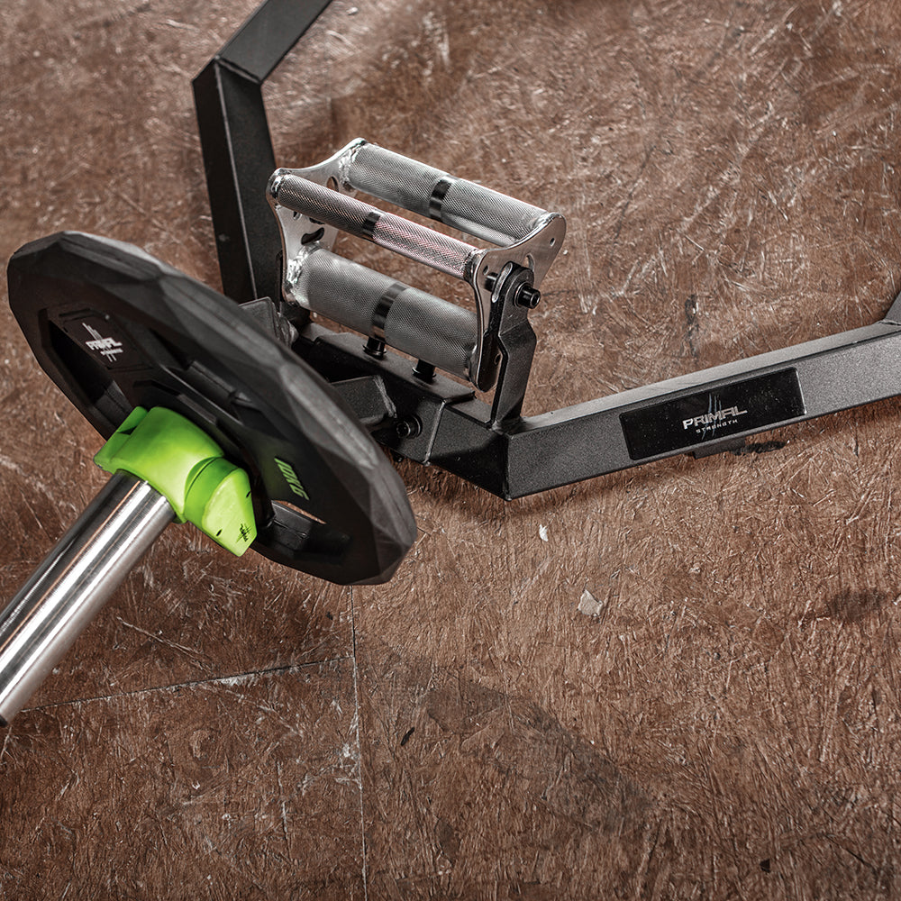 the collar and sleeve of a olympic shrug bar loaded with a weight disc