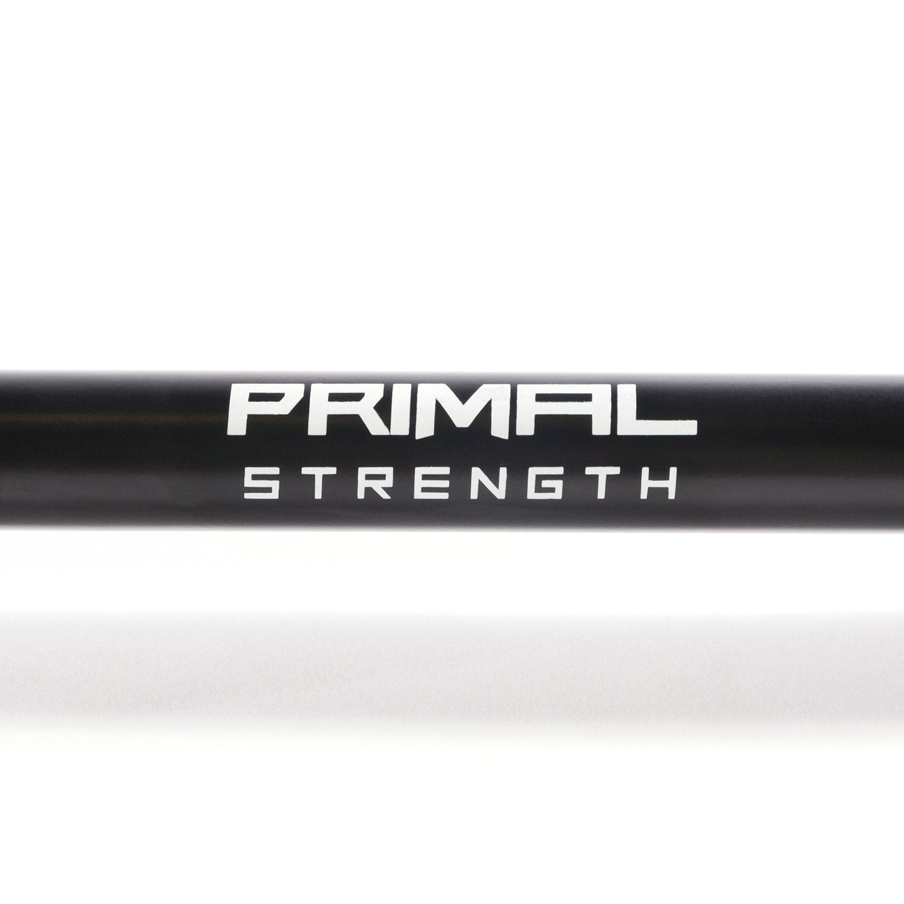 primal strength logo on a black olympic barbell