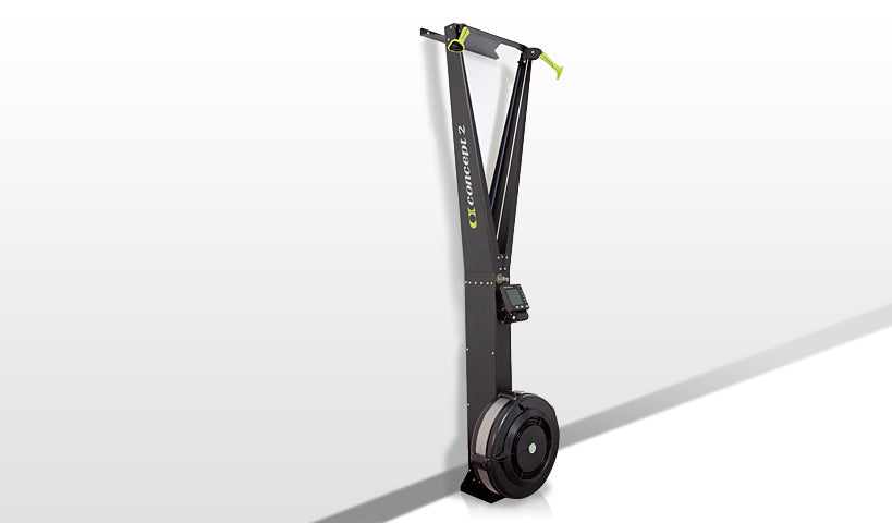 a skierg fitness machine mounted to the wall